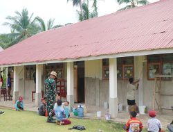 Satgas TMMD Bersama Warga, Guru, dan Siswa Laksanakan Pengecatan Ruang Kelas SMP Negeri Bungku Selatan